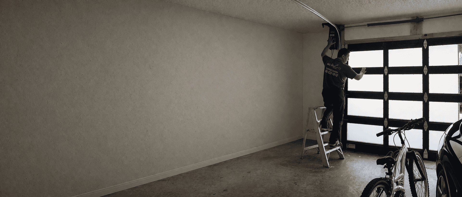SecureLifts garage door repair technician working on a garage door in South Florida