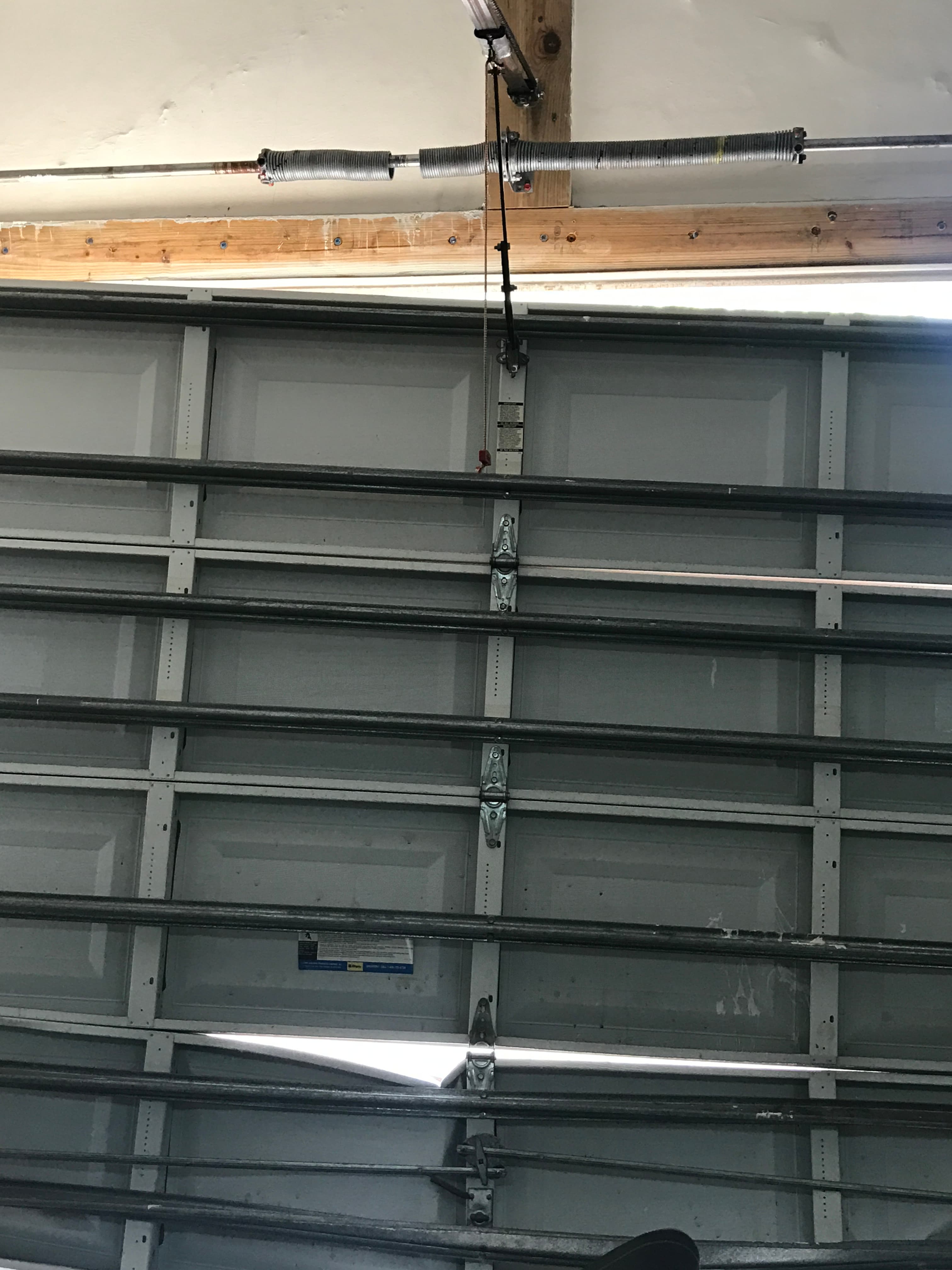 Broken garage door spring repair by SecureLifts