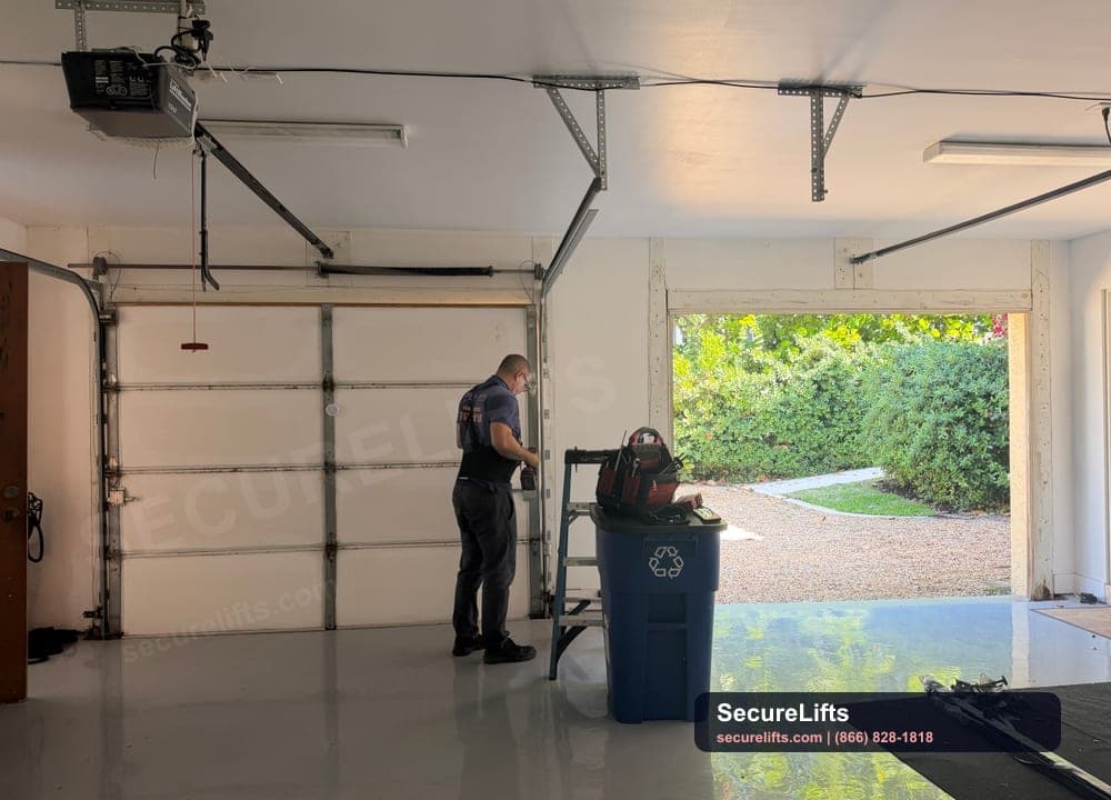 SecureLifts technician servicing a residential garage door