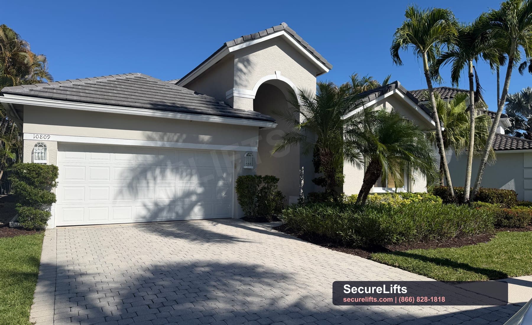 Traditional white garage door on South Florida home