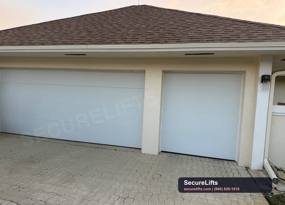 Clean white double garage door installed in South Florida