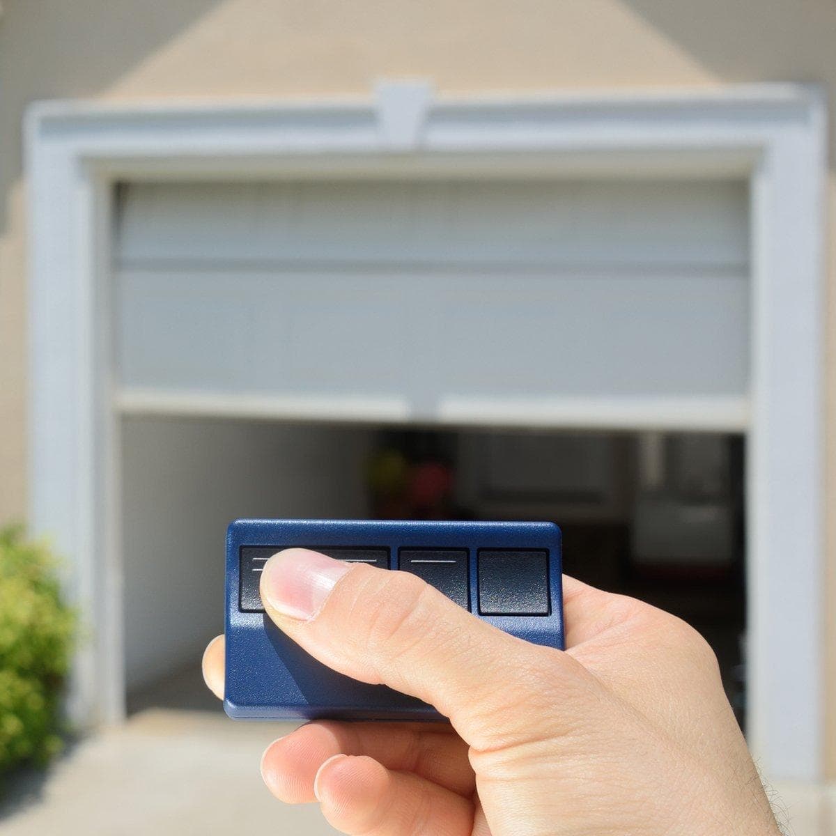 Testing garage door opener remotes and safety settings